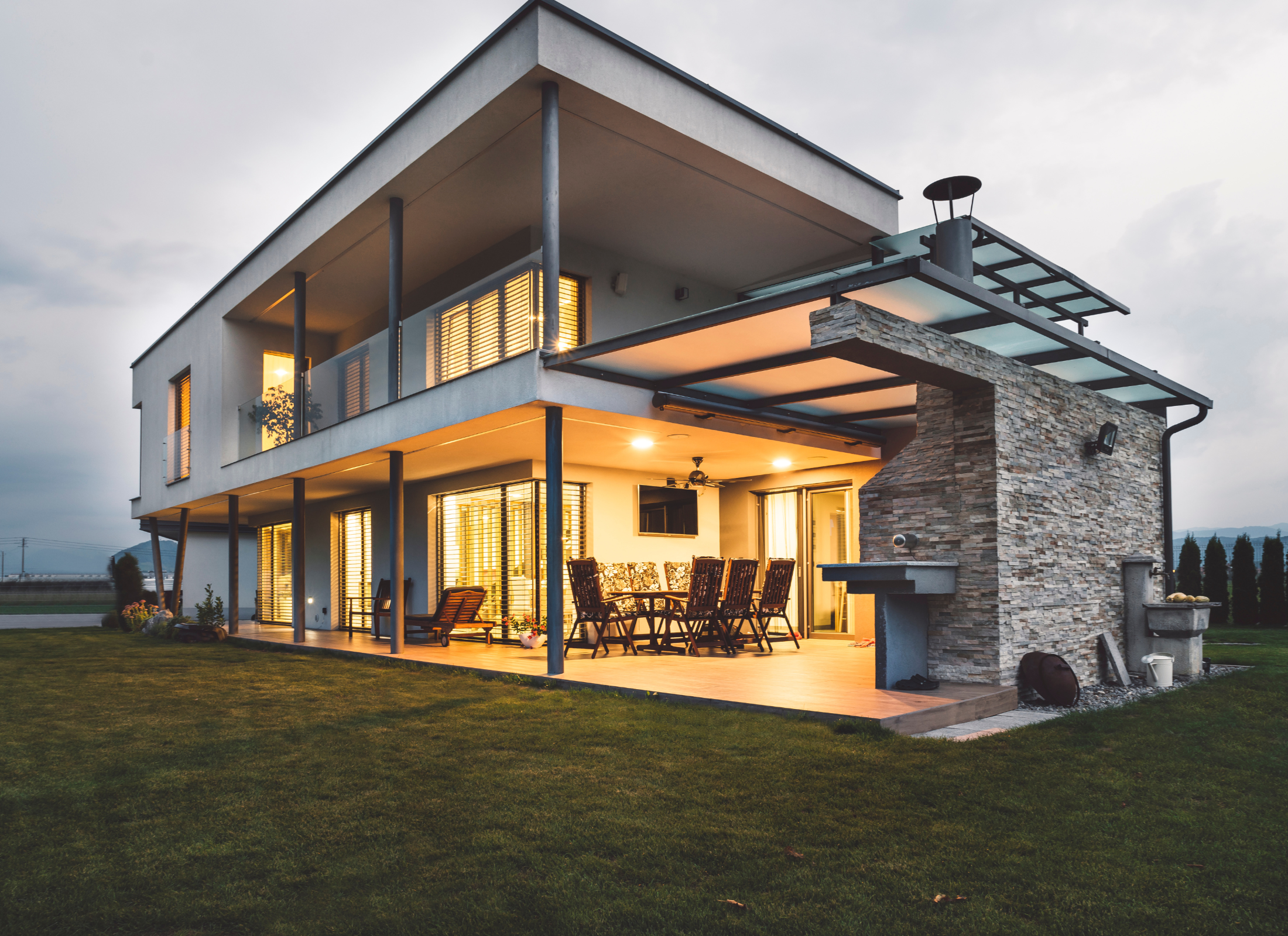 Modern house with an open patio area at dusk